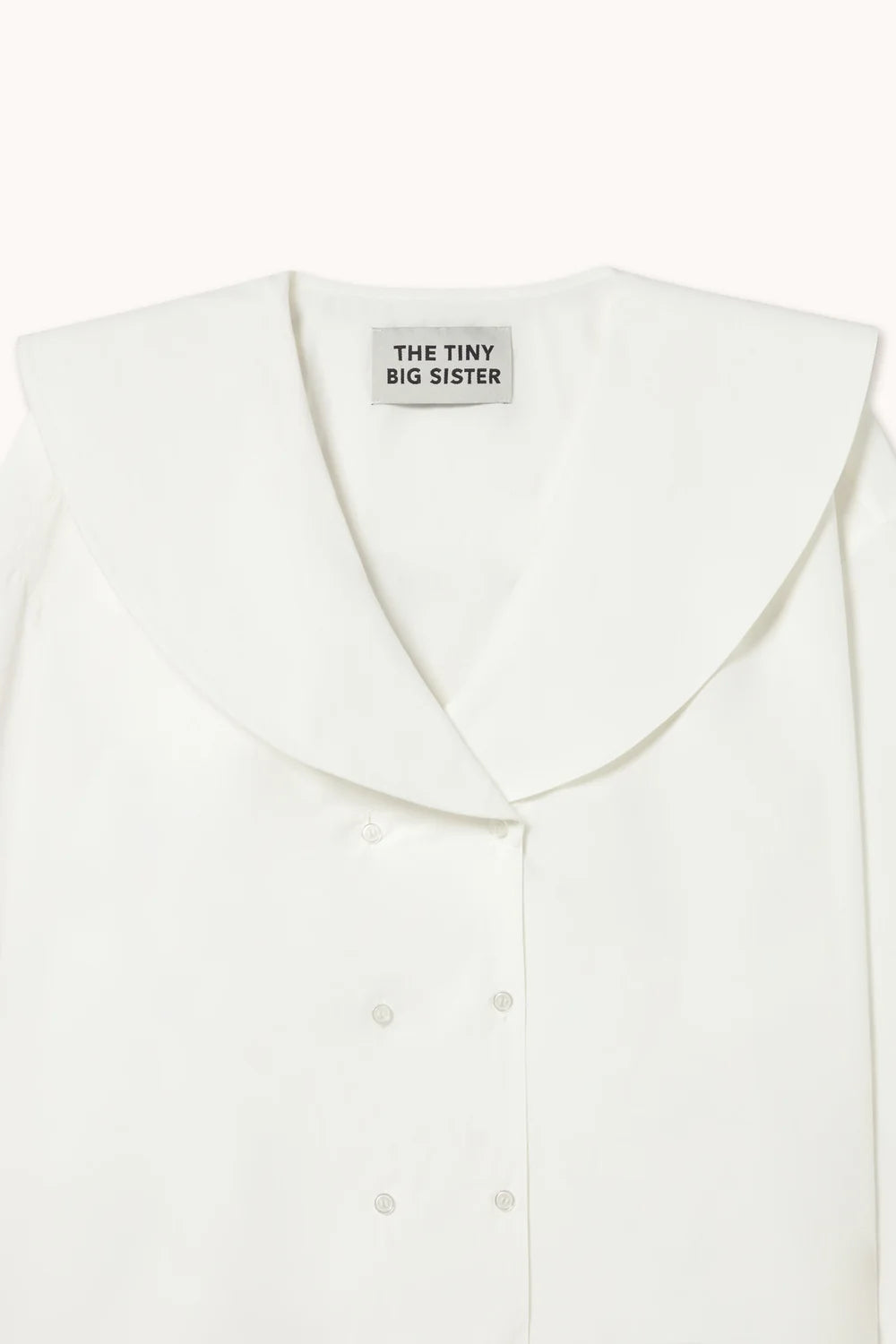 Blouse blanche avec doubles boutons